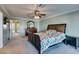 Well-lit main bedroom features a ceiling fan and ensuite access, offering a relaxing retreat at 2246 Almart Cir, Henderson, NV 89014