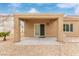 Backyard view of covered patio area with rock landscaping at 2404 Garganey Ave, North Las Vegas, NV 89084