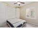 Bedroom with a Murphy bed system, vinyl flooring, blinds, and a ceiling fan at 2404 Garganey Ave, North Las Vegas, NV 89084