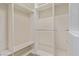 A glimpse into a walk-in closet with custom shelving, hanging rods and built-in storage at 2404 Garganey Ave, North Las Vegas, NV 89084