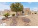 Inviting single-story home with well-maintained desert landscaping and a rock garden at 2404 Garganey Ave, North Las Vegas, NV 89084