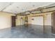 Spacious garage with epoxy flooring, built-in storage, and overhead racks at 2404 Garganey Ave, North Las Vegas, NV 89084