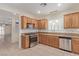 Kitchen featuring granite counters, stainless steel appliances, and lots of cabinets at 2404 Garganey Ave, North Las Vegas, NV 89084