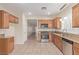 Bright kitchen featuring stainless steel appliances, granite counters, and tiled floors at 2404 Garganey Ave, North Las Vegas, NV 89084