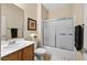 Well-lit bathroom with a shower-tub combo and a modern vanity at 2467 Moonlight Valley Ave, Henderson, NV 89044