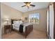 Cozy bedroom with a ceiling fan and window bringing in natural light at 2467 Moonlight Valley Ave, Henderson, NV 89044