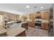 Modern kitchen with stainless steel appliances, ample counter space, and recessed lighting at 2467 Moonlight Valley Ave, Henderson, NV 89044