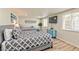 Bedroom featuring two beds, light blue dresser, and gray and white bedding at 2825 E Hacienda Ave, Las Vegas, NV 89120