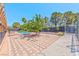 Paver-covered community space with picnic tables and recreational area next to pool at 2825 E Hacienda Ave, Las Vegas, NV 89120