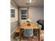 Cozy dining area featuring a wooden table, upholstered chairs, and natural light at 2829 Mozia Ct, Henderson, NV 89044