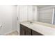 Bathroom featuring single vanity, dark wood cabinets, and shower-tub combo at 2894 Via Firenze, Henderson, NV 89044