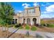 Beautiful two-story home with desert landscaping and covered entryway, shutters, and a tile roof at 2894 Via Firenze, Henderson, NV 89044