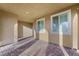 Neutral covered patio with patterned brick flooring, offering a shaded outdoor space at 2894 Via Firenze, Henderson, NV 89044