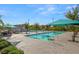 Community pool with shaded lounge areas, perfect for relaxation and recreation at 2894 Via Firenze, Henderson, NV 89044