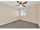 Carpeted bedroom features a ceiling fan and shuttered window at 3064 Bicentennial Pkwy, Henderson, NV 89044