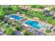 Aerial shot of community pools offering ample seating, cabanas, and well maintained landscaping at 3064 Bicentennial Pkwy, Henderson, NV 89044