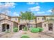 Charming townhome features a stone facade, well-manicured landscaping, and inviting walkway leading to the front door at 3064 Bicentennial Pkwy, Henderson, NV 89044