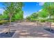 A landscaped park area with picnic tables, decorative trees, and a central gazebo at 3064 Bicentennial Pkwy, Henderson, NV 89044