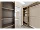 Custom walk-in closet with shelving and drawers, providing ample storage space and easy organization at 3064 Bicentennial Pkwy, Henderson, NV 89044