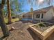 Landscaped backyard with mature trees and patio space at 3104 Archwood Way, Las Vegas, NV 89134