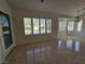 Bright dining area featuring tile flooring, large windows with shutters, and modern lighting at 3104 Archwood Way, Las Vegas, NV 89134