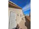 A view of the home's exterior with an outdoor air conditioning unit and security door at 3104 Archwood Way, Las Vegas, NV 89134