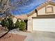 Charming single-story home featuring a well-maintained front yard with a two car garage at 3104 Archwood Way, Las Vegas, NV 89134