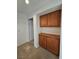 Hallway with built-in wood cabinets and carpet at 3104 Archwood Way, Las Vegas, NV 89134