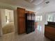 Bright kitchen with tile flooring, wood cabinets, and stainless steel refrigerator at 3104 Archwood Way, Las Vegas, NV 89134