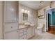 Bathroom featuring a vessel sink, granite countertop, and built-in storage at 312 Manti Pl, Henderson, NV 89014