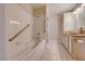 Bathroom showing the jetted tub and shower combination with tile surround at 312 Manti Pl, Henderson, NV 89014