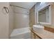 Tiled tub/shower combo, vessel sink with granite countertop, and updated fixtures at 312 Manti Pl, Henderson, NV 89014