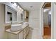 Bright bathroom featuring a double sink vanity, granite countertop, and vessel sinks at 312 Manti Pl, Henderson, NV 89014