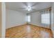 Spacious bedroom featuring hardwood floors, natural light, and a ceiling fan at 312 Manti Pl, Henderson, NV 89014