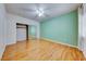 This spacious bedroom has a ceiling fan, laminate floors and ample closet space at 312 Manti Pl, Henderson, NV 89014