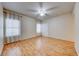 Spacious bedroom featuring hardwood floors, natural light, and a ceiling fan at 312 Manti Pl, Henderson, NV 89014