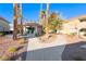 Exterior of the community clubhouse, framed by palm trees and landscaped walkway at 312 Manti Pl, Henderson, NV 89014