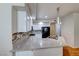 Bright kitchen featuring granite countertops, tile backsplash, stainless steel appliances, and pendant lighting at 312 Manti Pl, Henderson, NV 89014