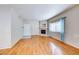 Cozy living room features wood-look floors, natural light, and a fireplace at 312 Manti Pl, Henderson, NV 89014