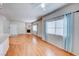 Open-concept living room features a fireplace, natural light, and hardwood floors at 312 Manti Pl, Henderson, NV 89014