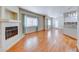 Spacious living room featuring an open floor plan, fireplace, and hardwood flooring at 312 Manti Pl, Henderson, NV 89014