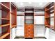 Walk-in closet with custom wood shelves and drawers at 322 Karen Ave # 1902, Las Vegas, NV 89109