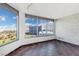 Bright living room with large windows showcasing city views and a stylish stone accent wall at 322 Karen Ave # 1902, Las Vegas, NV 89109