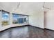 A sun-filled living room with tile floors, large windows overlooking the cityscape, and a modern accent wall at 322 Karen Ave # 1902, Las Vegas, NV 89109