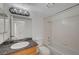 This bathroom features a vanity, granite countertop, and a shower and tub combo at 3705 Covewick Dr, North Las Vegas, NV 89032