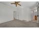 Bedroom with neutral carpet, ceiling fan, access to ensuite bathroom and a closet at 3705 Covewick Dr, North Las Vegas, NV 89032