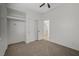 This bedroom features carpet flooring, a ceiling fan, and a closet at 3705 Covewick Dr, North Las Vegas, NV 89032