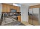 Kitchen showcasing stainless steel appliances, granite countertops, and ample cabinetry at 3705 Covewick Dr, North Las Vegas, NV 89032