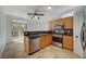 Well-equipped kitchen with stainless steel appliances, granite countertops, and a breakfast bar at 3705 Covewick Dr, North Las Vegas, NV 89032