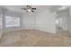 Bright living room with tile flooring, ceiling fan, and natural light from the window at 3705 Covewick Dr, North Las Vegas, NV 89032